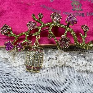 Sparkly Lantern Dangling From Flower Covered Branch Brooch